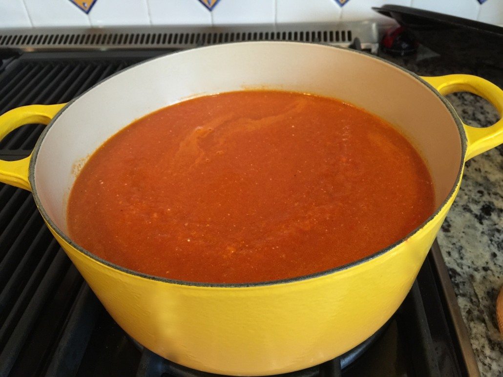 finishing the homemade tomato soup