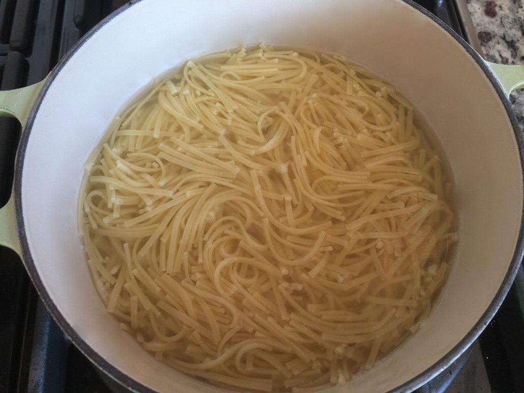 Cooking the noodles for the German beef soup recipe